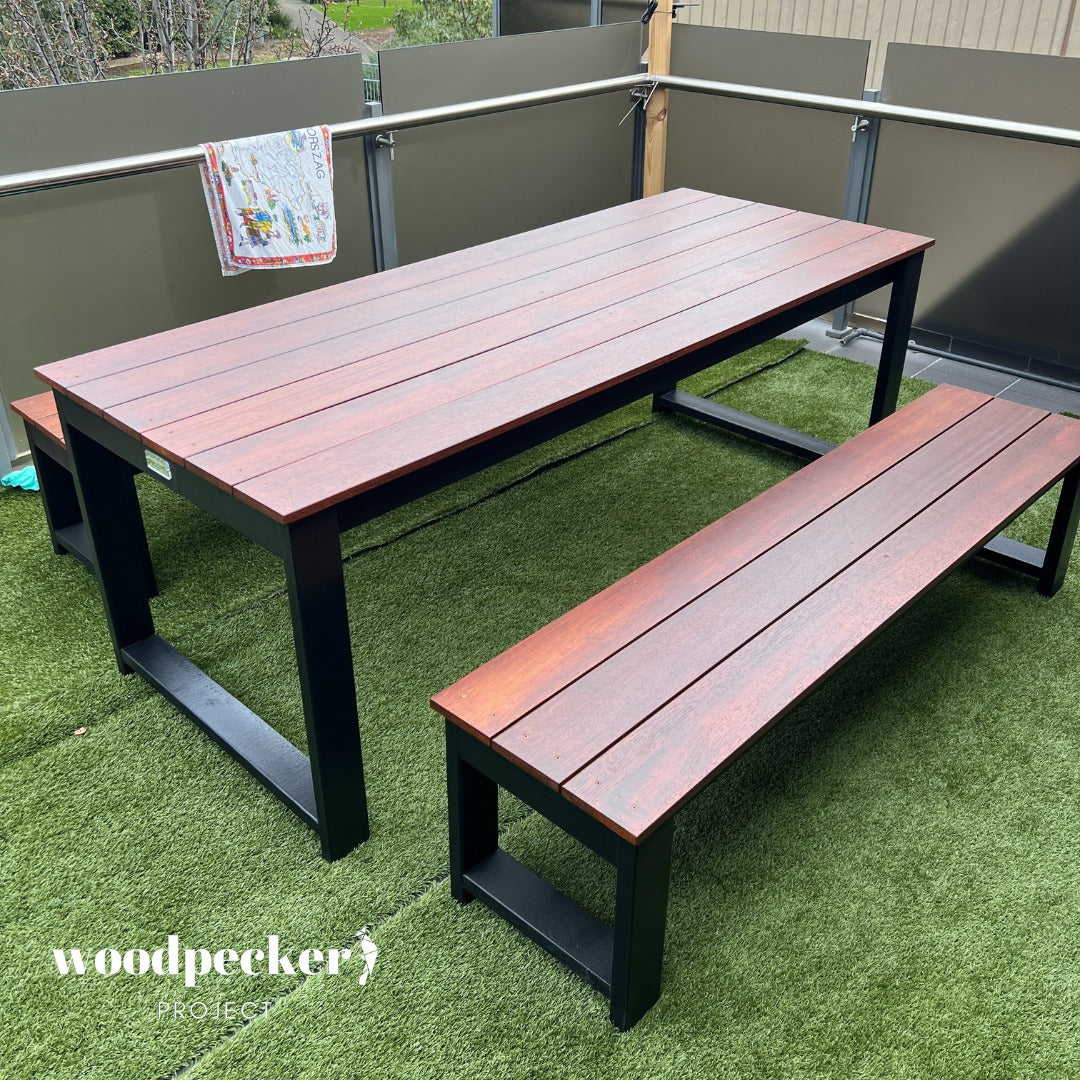 Weather-resistant Merbau wood outdoor table set, suitable for deck use and built to withstand various weather conditions