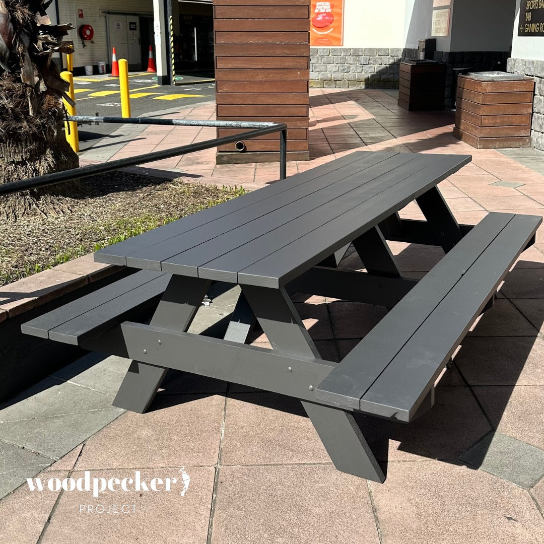 Eco-friendly picnic table made from sustainable pine and hardwood materials.