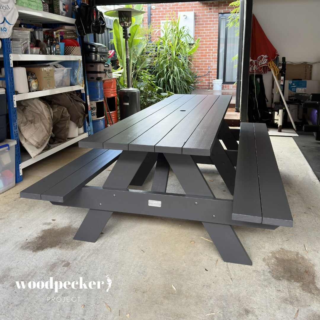 Sturdy pine and hardwood picnic table ensemble designed for heavy outdoor use.