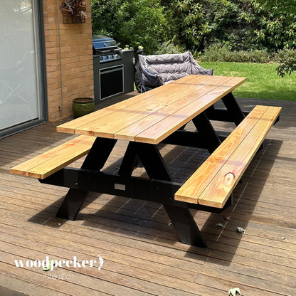 Experience the simple pleasure of outdoor dining with this traditional picnic table, providing a charming setting for picnics, where memories are made and laughter abounds.