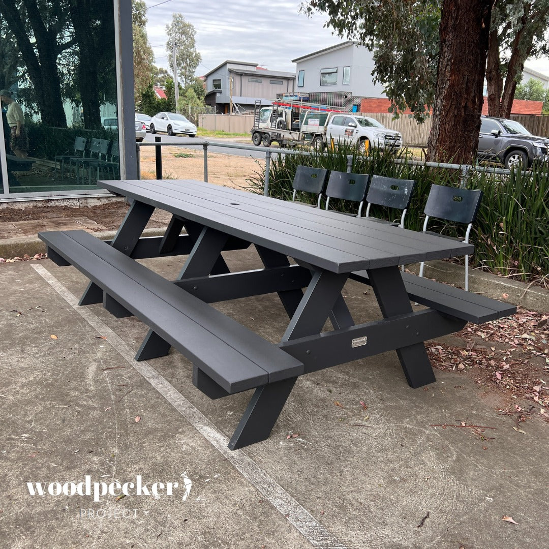 Classic picnic table made from pine and hardwood, blending seamlessly with natural surroundings.