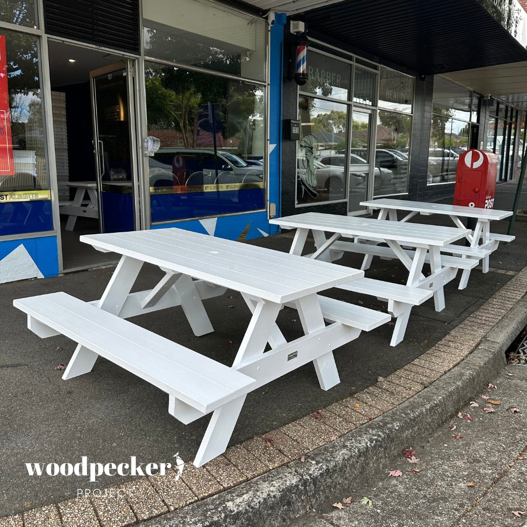 Handcrafted pine and hardwood picnic table perfect for park relaxation and BBQs.