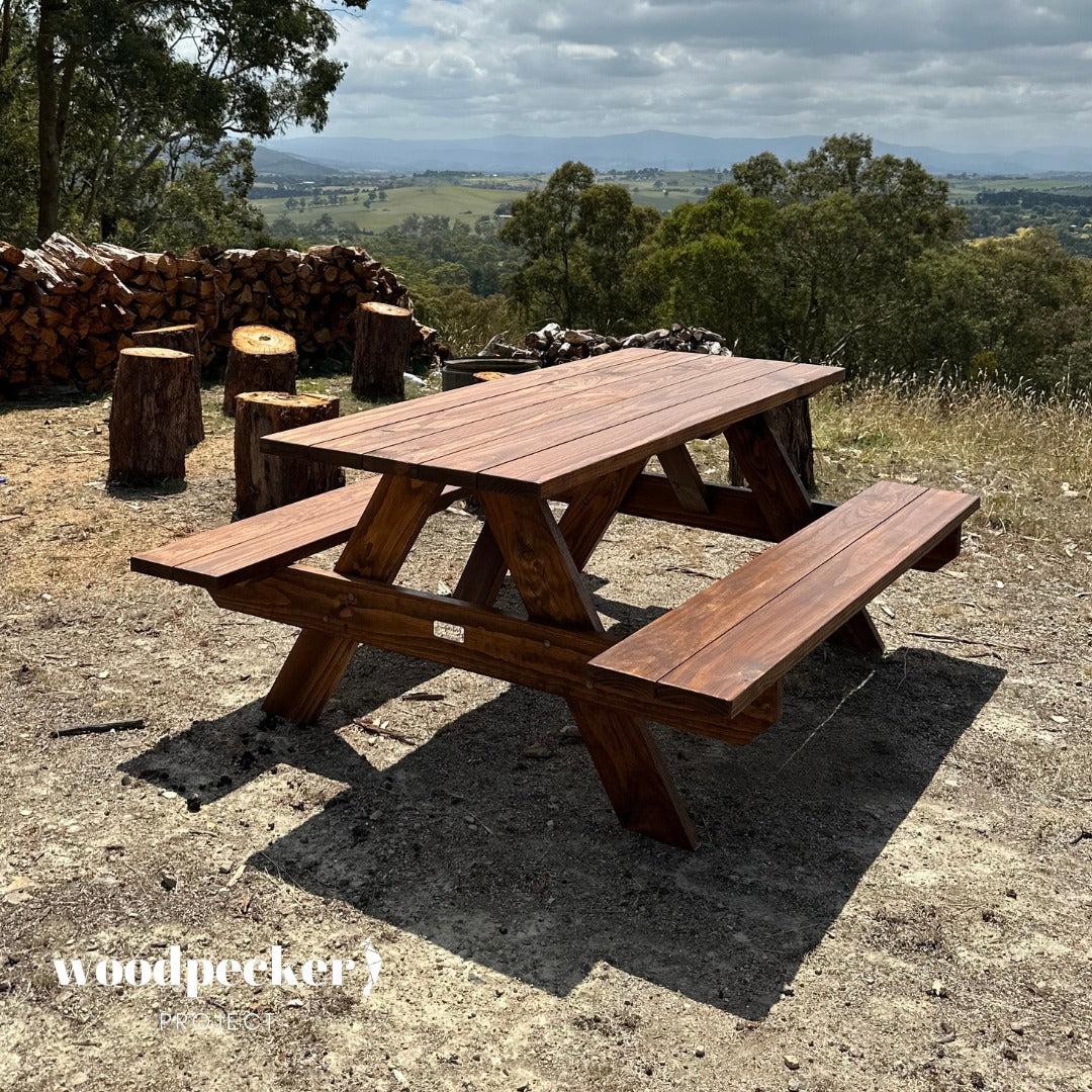 Crafted from solid wood, this picnic table is as sturdy as it is charming, making it the perfect addition to parks and recreation areas, inviting visitors to relax and unwind.