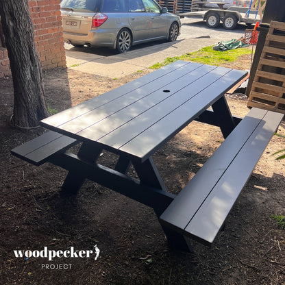 Elegant picnic table made from pine and hardwood, enhancing outdoor entertainment areas.