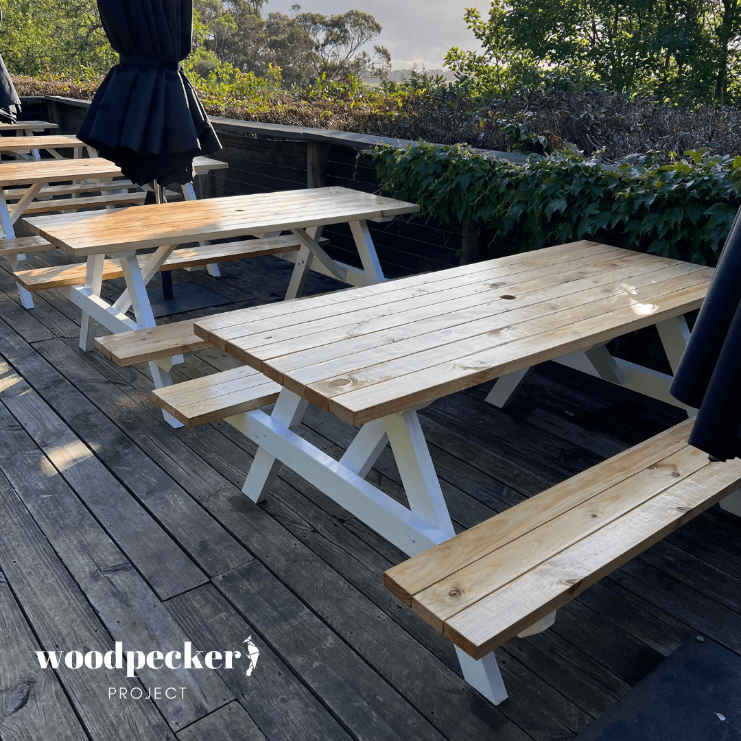 Picnic tables with picnic tablecloths for added elegance