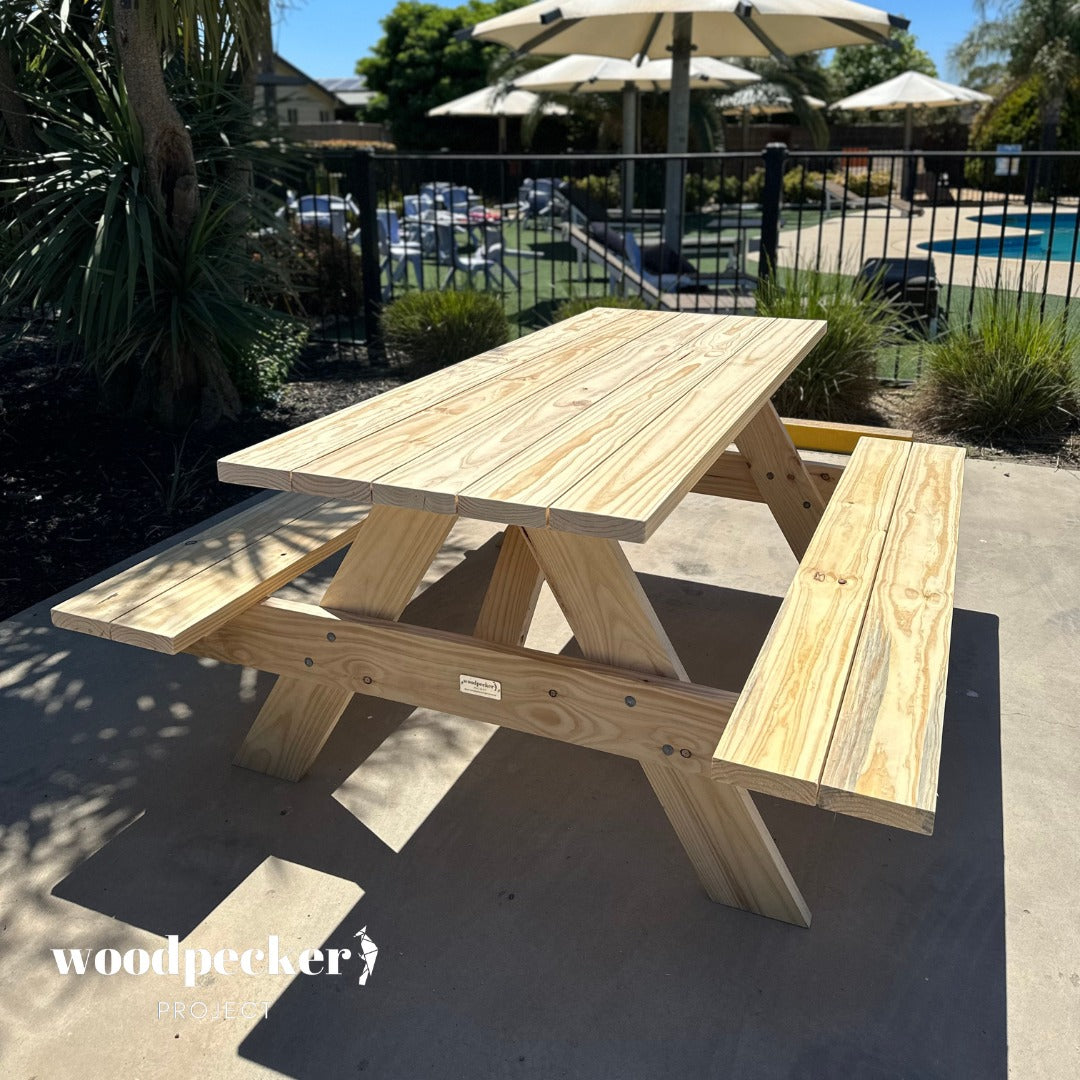 Stylish picnic table ensemble crafted from pine and hardwood for timeless outdoor enjoyment.