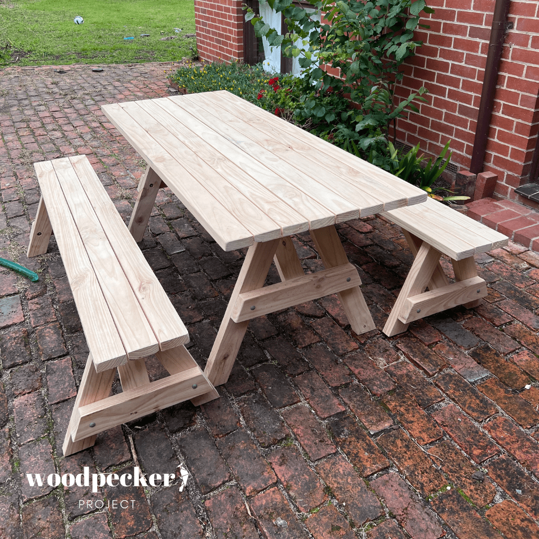 A family-friendly picnic table set with ample seating provided by two large benches, perfect for outdoor meals and social gatherings