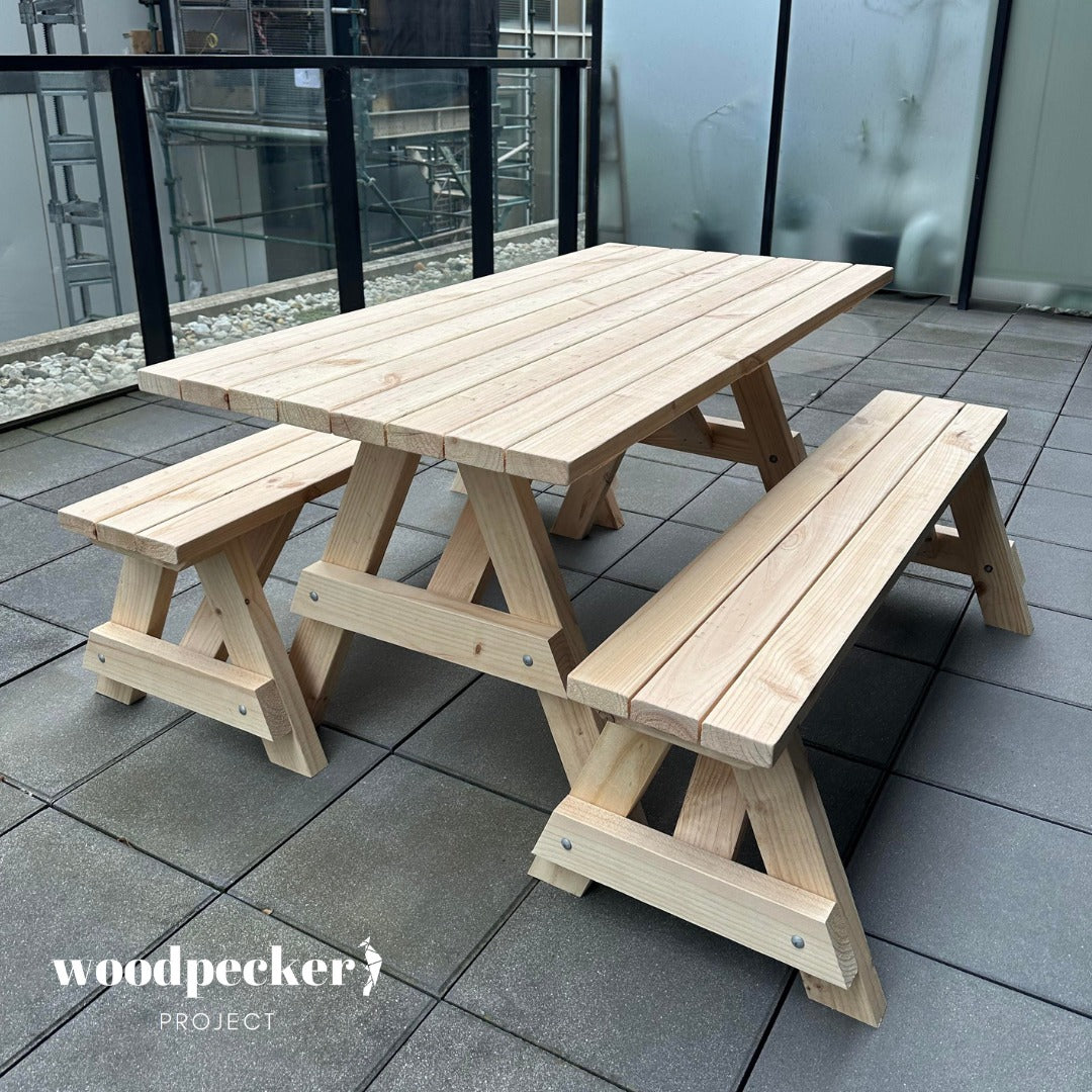 A durable picnic table set crafted from solid wood, featuring a spacious table and two sturdy benches, ideal for outdoor dining and relaxation.