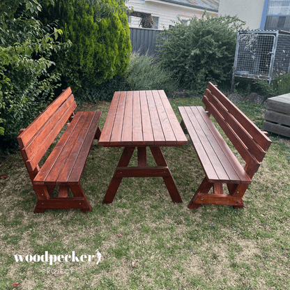 A durable picnic table set with a natural wood finish and benches with backrests, providing both style and comfort for outdoor dining.