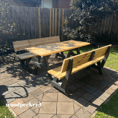 A high-quality picnic table set made from solid wood, featuring benches with backrests for added comfort during meals and gatherings