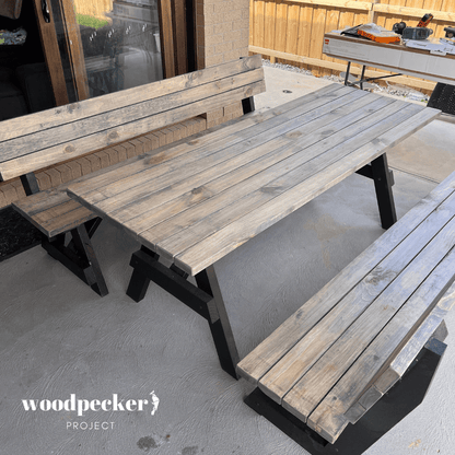 An elegant picnic table set featuring a durable table and benches with backrests, providing both comfort and functionality for outdoor dining