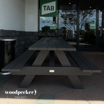 Sturdy pine and hardwood picnic table ensemble for picnics, camping, and outdoor events.