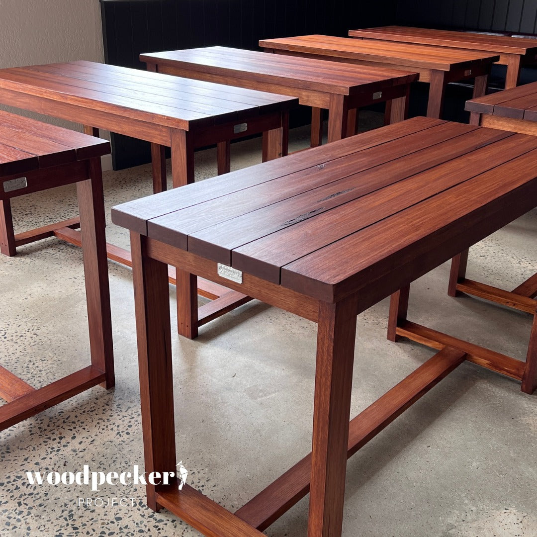 Evoke a sense of rustic elegance in your outdoor space with this stunning solid hardwood table, handcrafted to perfection and built to endure outdoor elements.