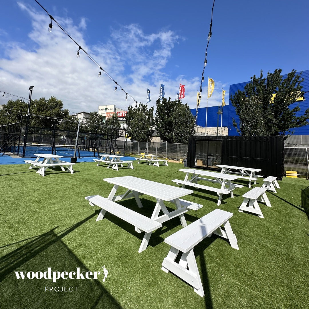 Transform your event with our elegant white picnic table, available for hire, adding a touch of sophistication and charm to any outdoor gathering or celebration