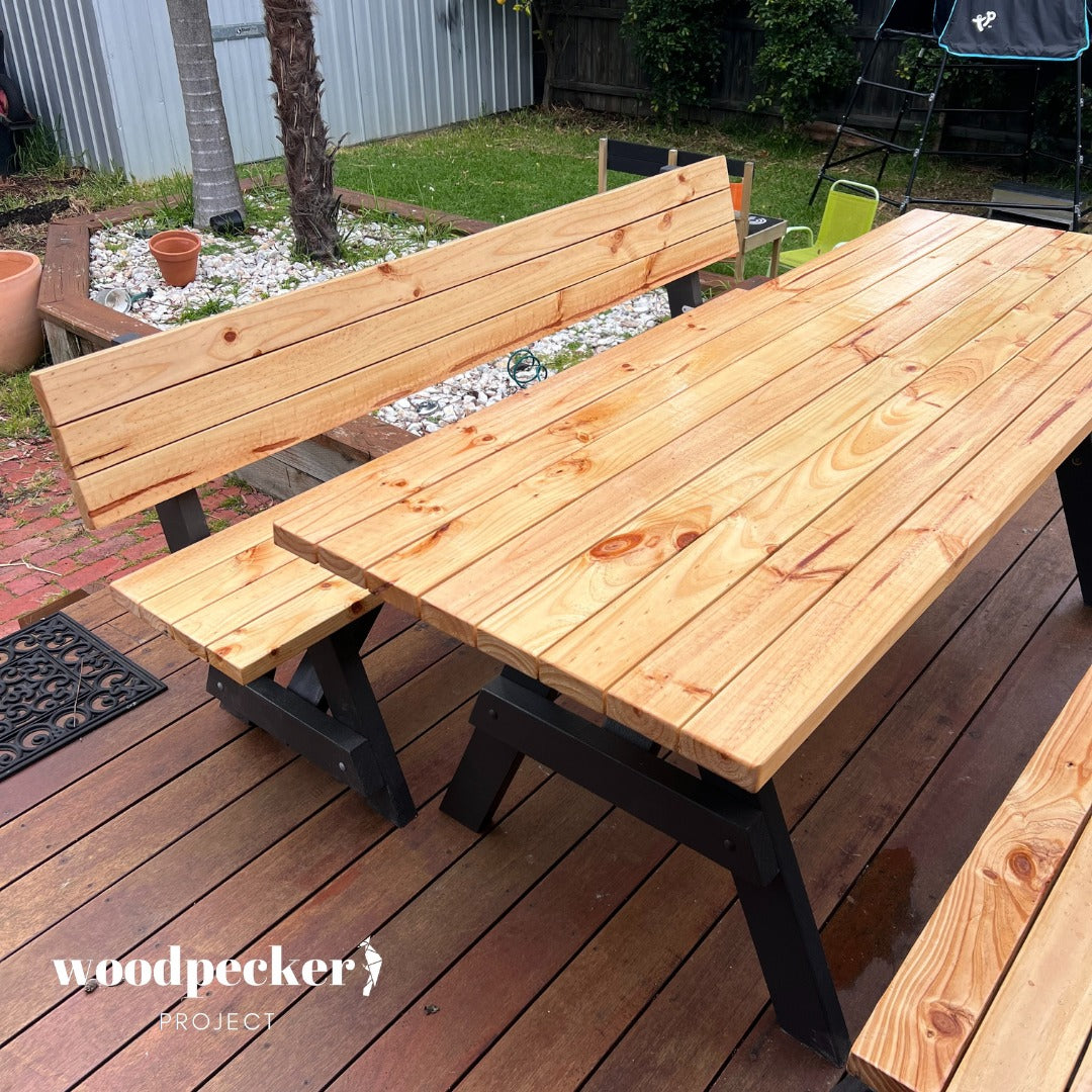 A premium wooden picnic table set with ergonomically designed backrests on the benches, ensuring maximum comfort for outdoor relaxation.