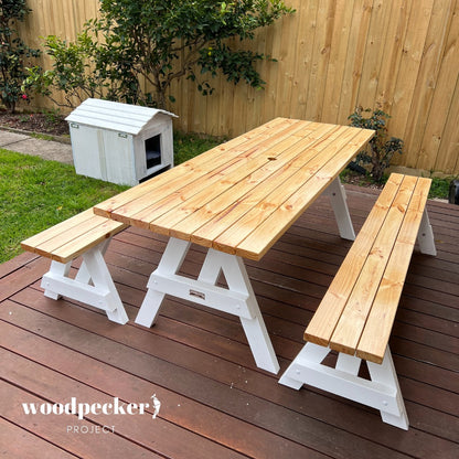 A contemporary picnic table set with clean lines and a natural wood finish, perfect for modern outdoor spaces and patios