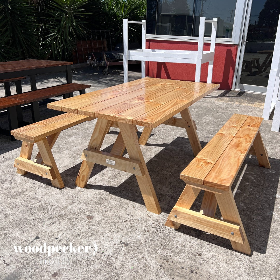 A high-quality picnic table set featuring a weatherproof finish, ensuring longevity and durability in various outdoor settings