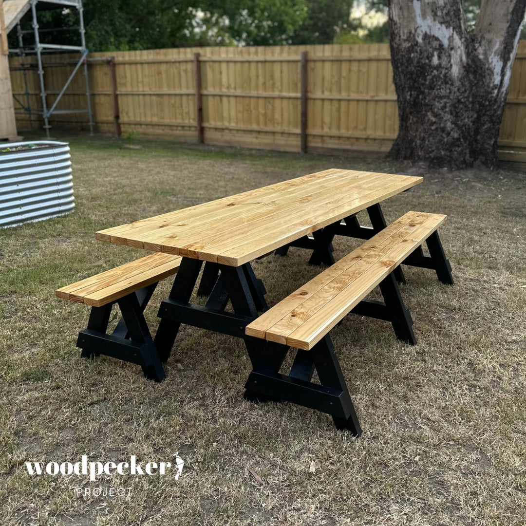 A practical picnic table set with a detachable bench design, allowing for flexible seating arrangements and easy storage