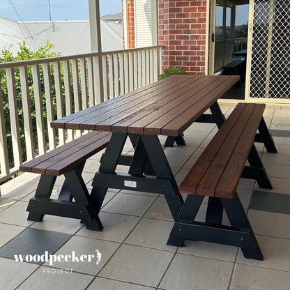 A stylish picnic table set with a natural wood finish, designed to enhance any outdoor space with its timeless appeal and functional design