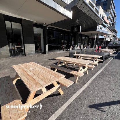 Durable natural picnic table set for rent, designed for outdoor events and providing ample seating for guests