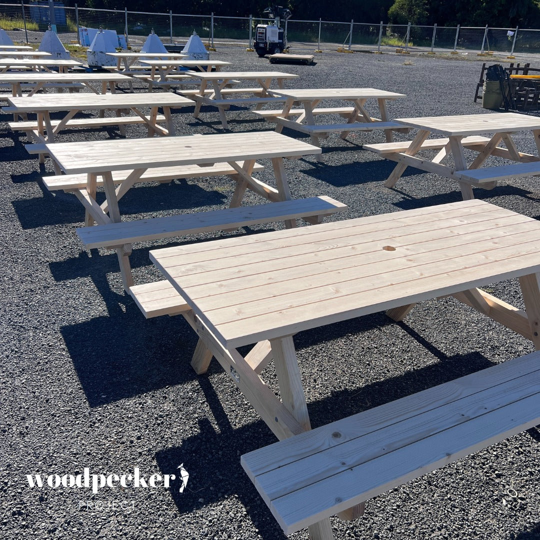 Classic natural wood picnic table set for rent, ideal for outdoor weddings and elegant garden parties