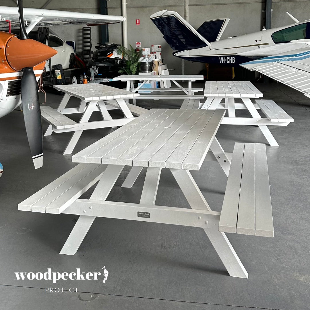 Make your event stand out with our exclusive white picnic table, perfect for hire, providing a timeless and charming centerpiece for any outdoor gathering