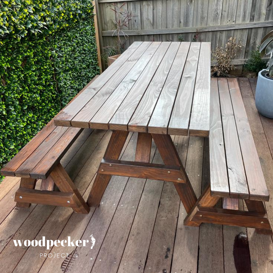 A versatile picnic table set with a natural finish, designed to blend seamlessly with any outdoor decor and provide practical seating